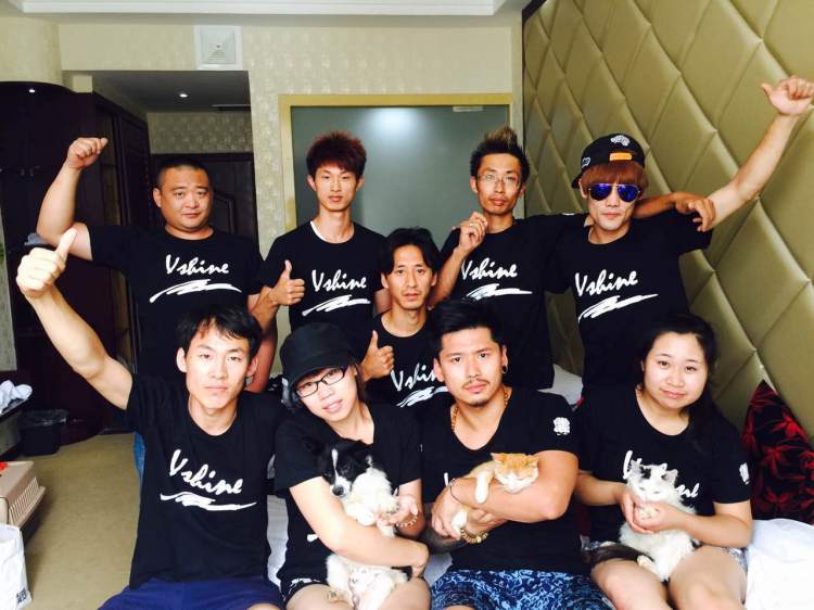 Vshine activists with animals rescued by Peter Li, HSI China policy specialist. Vshine means “a small light of kindness that brings great change.” 